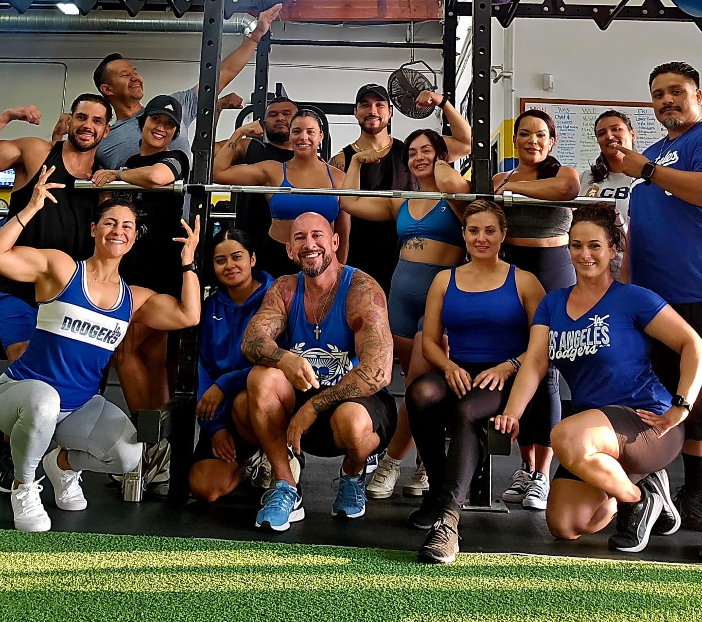 Evolve by L1G coaches and members together in front of the training rig